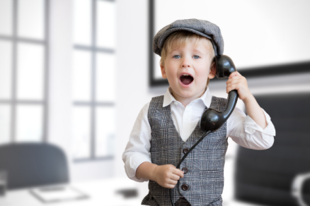 Child holding a telephone